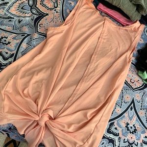 Pink muscle shirt with a tie in the back